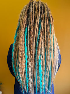 Lady with braided synthetic dreads blonde blue wavy straight